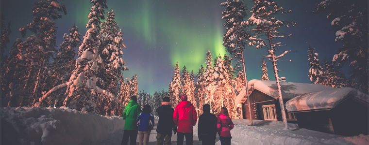 crowd watching aurora borealis northern lights