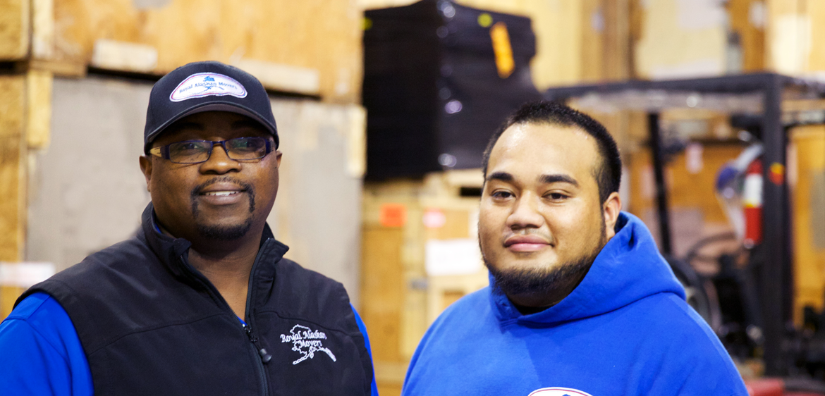 manager-worker-smiling-warehouse-cs-header employees smiling in warehouse