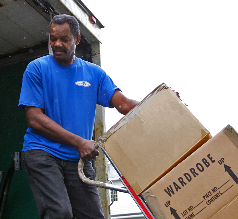 mover pulling boxes up ramp